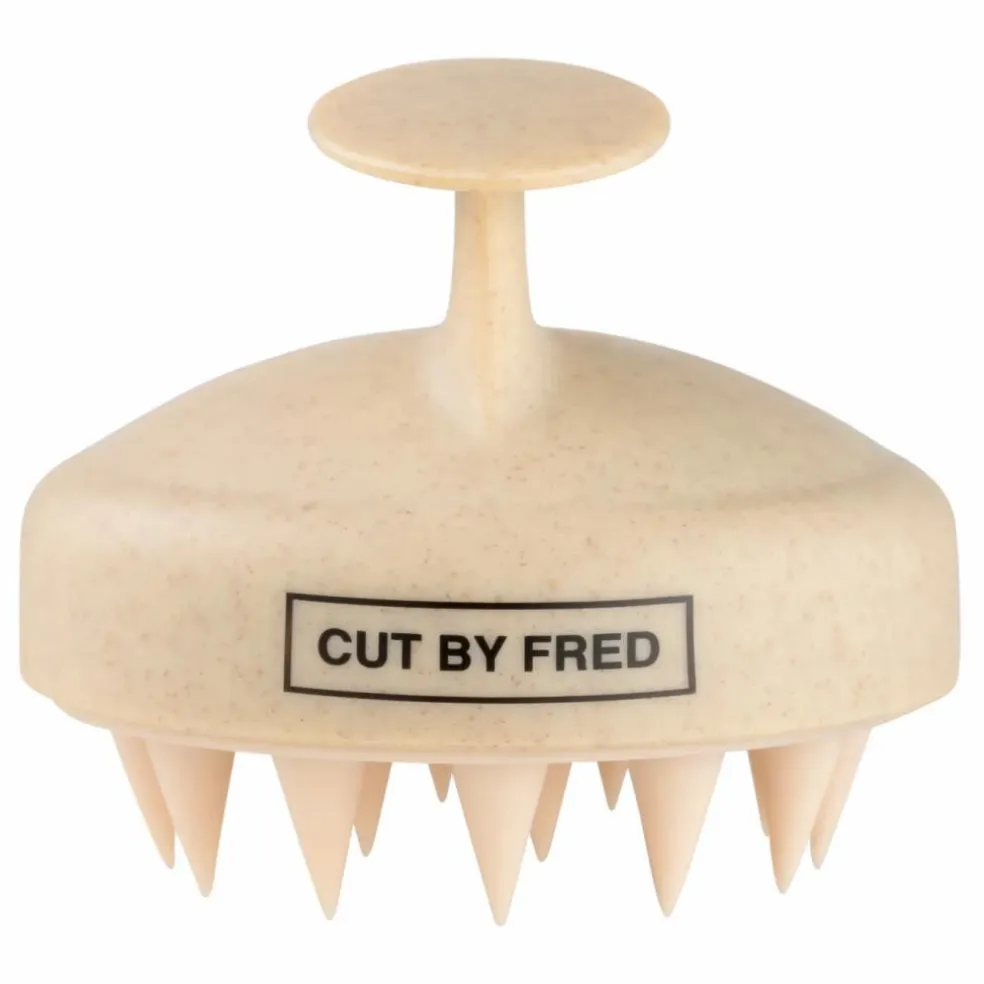 Brosse stimulante pour le cuir chevelu